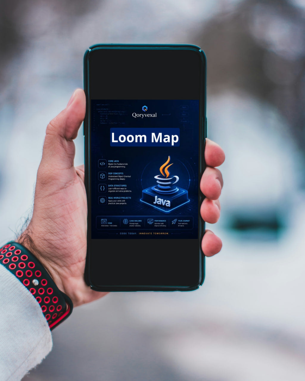 Hand holding a smartphone with a 'Free Kit' offer on the screen, blurred outdoor background